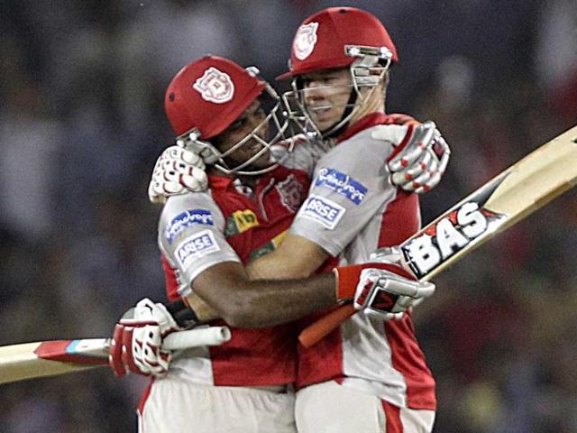 Kings XI Punjab's David Miller and R Sathish celebrate their team's victory over Royal Challengers Bangalore during the T20 league match in Mohali. PTI