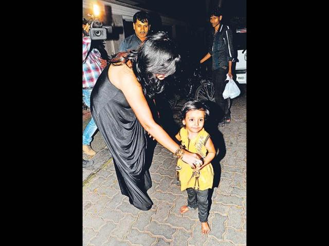 Ekta Kapoor seemed to love this baby she met outside her party venue. (Photos: Viral Bhayani)