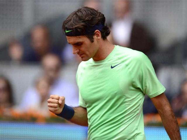 Swiss-player-Roger-Federer-celebrates-after-winning-his-tennis-match-against-Czech-player-Radek-Stepanek-at-the-Madrid-Masters-in-Madrid-AFP