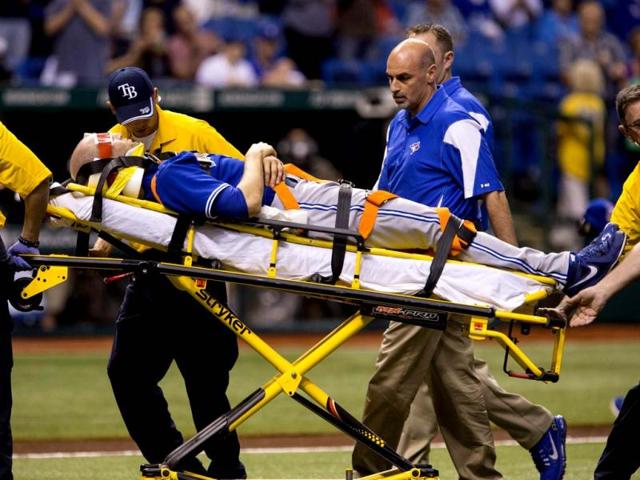 Toronto Blue Jays' pitcher J.A. Happ is wheeled off the field on a stretcher after he was injured during the second inning of their major league baseball game against the Tampa Bay Rays in St. Petersburg, Florida. (Reuters)