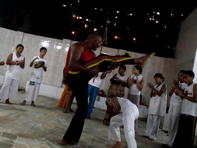 Blind capoeira teacher Joao Kanoa performs inside a "roda" (wheel) during a session at the Fallet slum, in Rio de Janeiro. Reuters photo