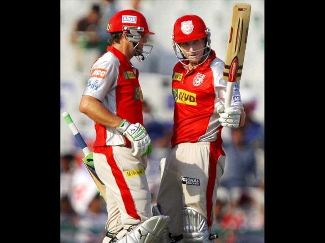 Kings XI Punjab batsman Shaun Marsh is greeted by skipper Adam Gilchrist on completing his half century during a T20 match against Rajasthan Royals in Mohali. (PTI)