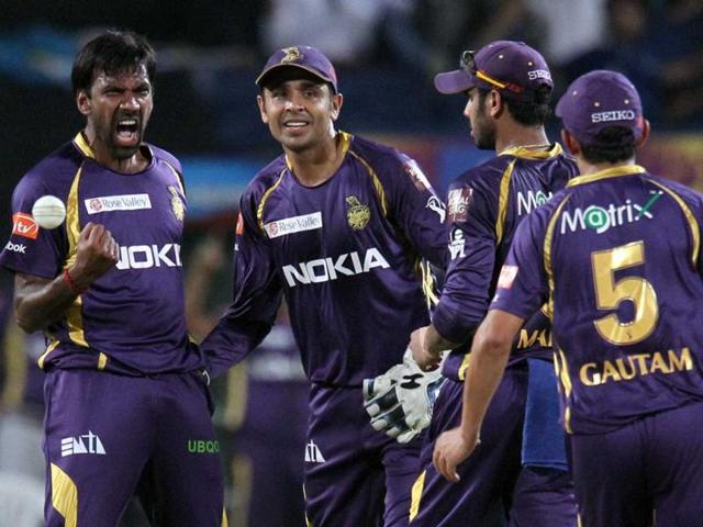 KKR's bowler Lakshmipathy Balaji (L) reacts after taking wicket of PWI batsman Yuvraj Singh during a T20 match in Pune. (PTI)