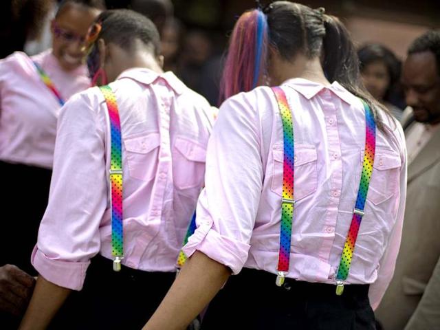 Members of the singing group Immeasurable wear their clothes backwards in tribute to Chris Kelly of the rap duo Kris Kross, at his funeral service in Atlanta. AP photo