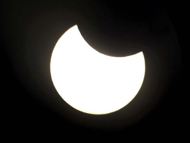 The annular solar eclipse can be seen through the viewfinder of a telescope positioned atop Observatory Hill in Sydney. Reuters photo