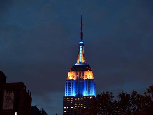 The Empire State Building is lit in the European Union's flag colors, blue and yellow, to mark Europe Day 2013 in New York. AFP photo