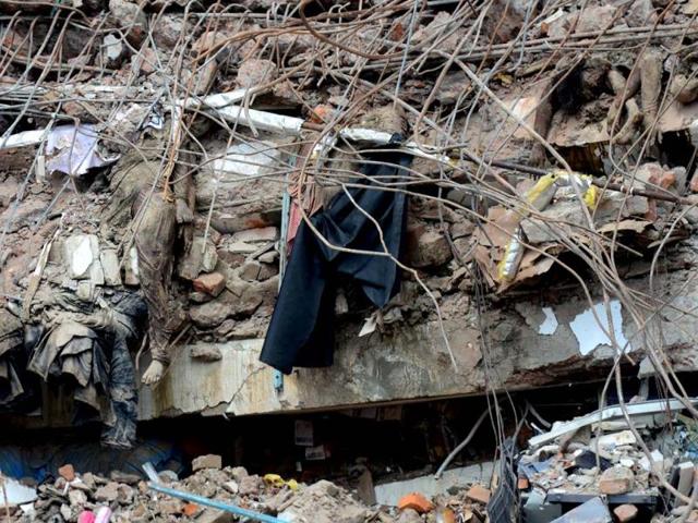 The bodies of garment workers lie crushed under rubble after an eight-storey building collapse in Savar, on the outskirts of Dhaka. AFP photo