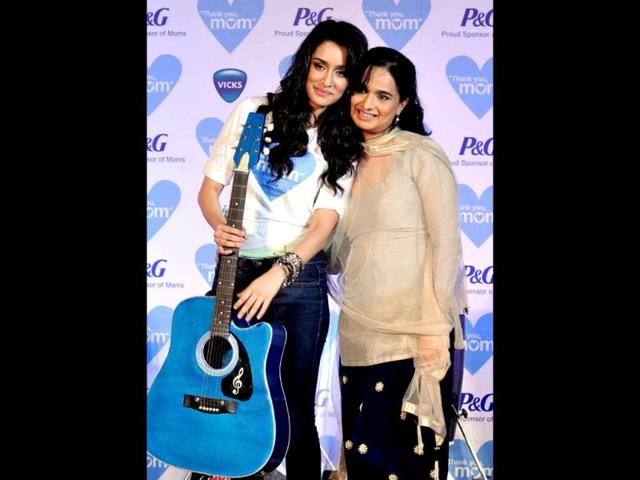 Shraddha Kapoor strikes a cute pose with her mom Shivangi Kapoor during a promotional event. (AFP Photo)