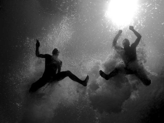 Oleksandr Gorshkovozov and Dmytro Mezhenskyi of the Ukraine dive during the Men's 10 Meter Platform Synchronized Finals at the Fort Lauderdale Aquatic Center on Day 4 of the AT&T USA Diving Grand Prix in Fort Lauderdale, Florida. (AFP)