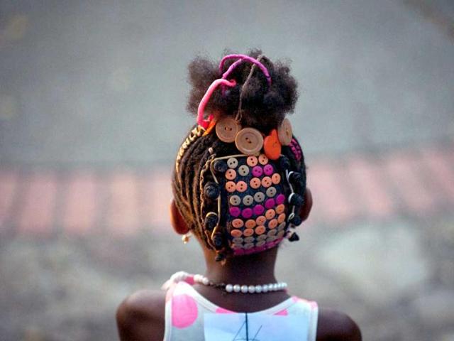 A girl presents an Afro-Colombian hairstyle during the 9th contest of Afro-hairdressers, in Cali, Valle del Cauca department, Colombia. (AFP Photo)