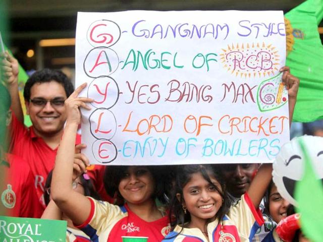 Royal Challengers Bangalore fans cheer them before the start of their T20 match against Kings XI Punjab at Chinnaswamy Stadium in Bengalore. (PTI Photo)