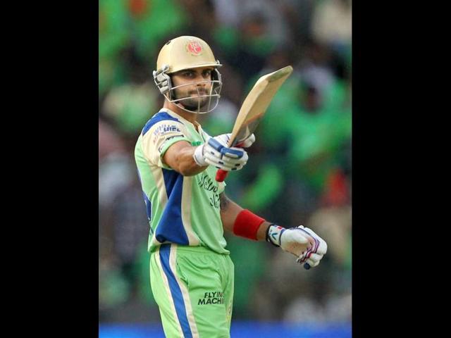 Royal Challengers Bangalore's Virat Kohli celebrates his fifty against Kings XI Punjab during their T20 match at Chinnaswamy Stadium in Bengalore. (PTI Photo)