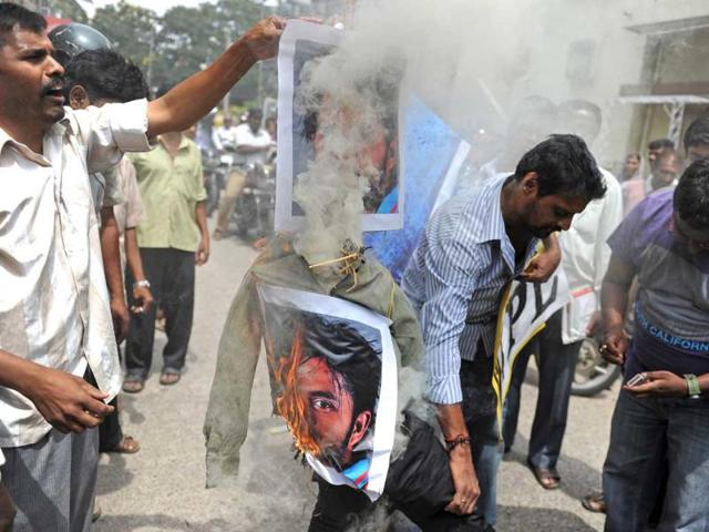 Protestors set fire to posters bearing portraits of cricketer Sreesanth and two other Twenty20 cricketers during a protest against their alleged involvement in spot-fixing, in Bangalore. AFP photo