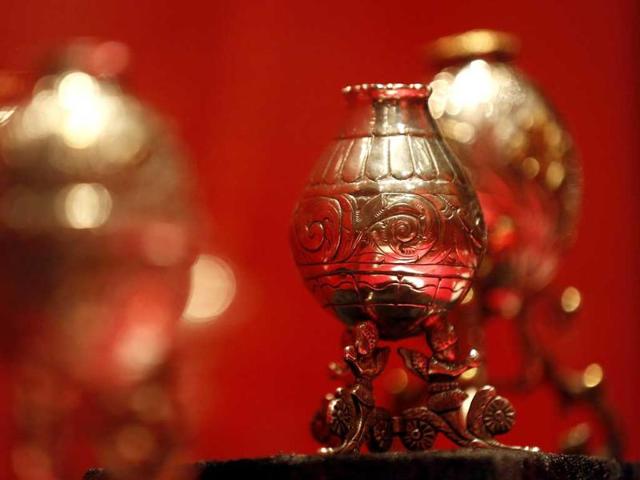 A silver "mate" cup which gauchos would drink a tea made from yearba from, is seen during an exhibition in St. Peter's Square at the Vatican. (Reuters)