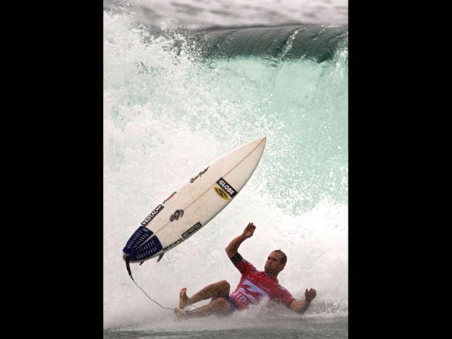 US CJ Hopgoog falls during the ASP world tour Billabong Rio Pro 2013 at Barra de Tijuca beach, in Rio de Janeiro. (AFP Photo)