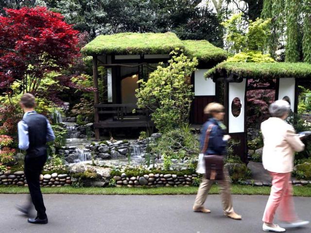 Visitors look at an artisan garden 'An Alcove (Tokonoma) Garden', designed by Kazuyuki Ishihara, during the Chelsea Flower Show in London. AP Photo