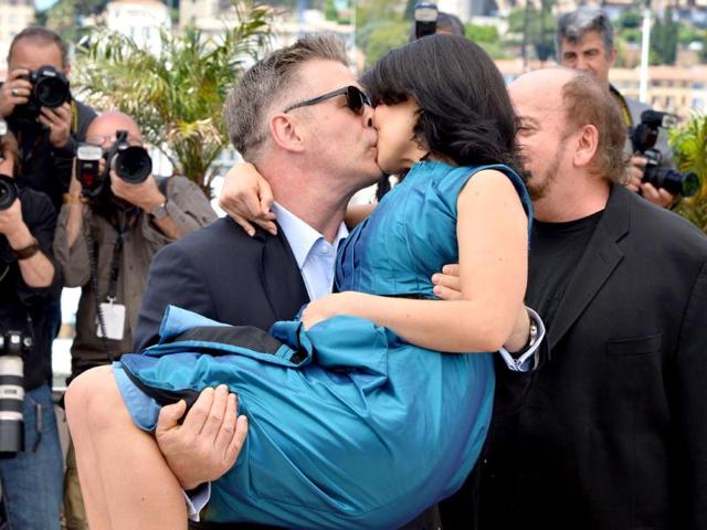 Baldwin and wife Hilaria kiss for the camera