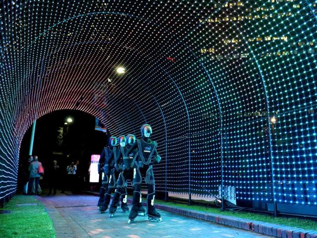 Rollerbladers glide through a light installation as landmarks around the city become part of Sydney's annual festival of light, music and ideas. (AFP)