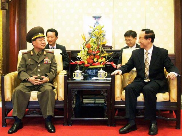 North Korean leader Kim Jong Un's envoy Choe Ryong Hae (L) talking with Wang Jiarui (R), a member of the Central Committee of the Communist Party of China, at the Diaoyutai State Guesthouse in Beijing. AFP Photo / KCNA via KNS