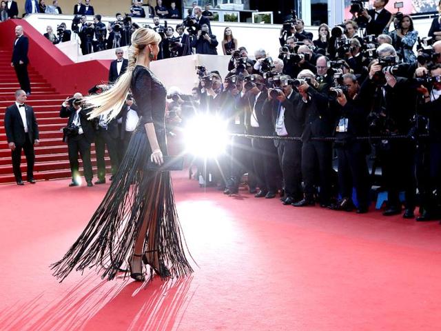 A well-timed skirt and hair swish! Adriana Karembeu poses for the shutterbugs.