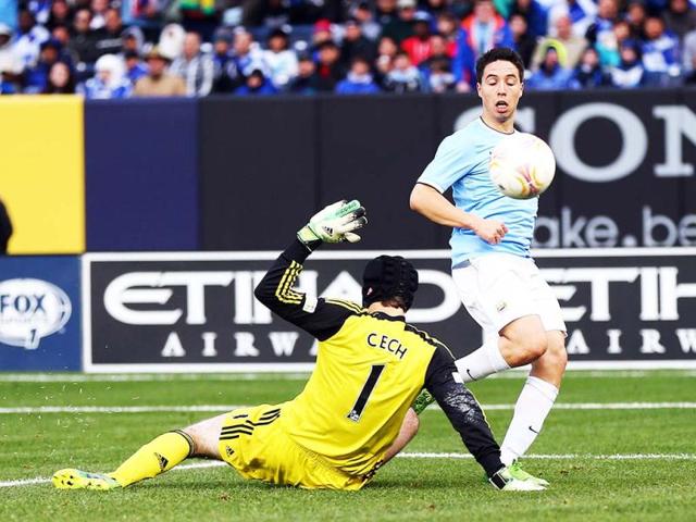 Samir Nasri #8 of Manchester City scores a goal past Petr Cech #1 of Chelsea at Yankee Stadium in the Bronx borough of New York City. Manchester City defeated Chelsea 5-3. (AFP)
