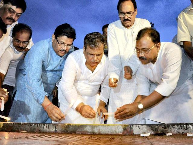 Congress party leaders in Bhubaneswar light candles to pay homage to the victims of the maoists attack on Congress party's convoy in Chhattisgarh. PTI Photo