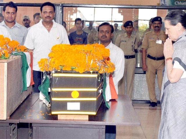Congress president Sonia Gandhi pays homage to Chhattisgarh Congress president Nand Kumar Patel in Raipur on Sunday. PTI Photo