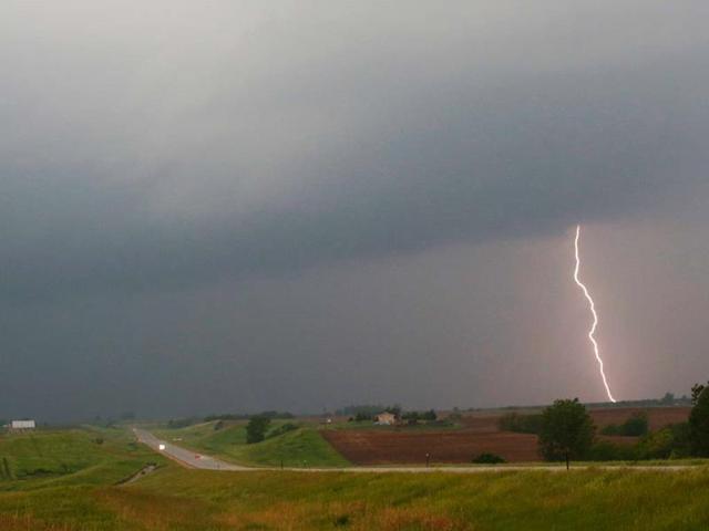 Lightning strikes as a thunderstorm moves across US-36 highway near White Cloud. AP photo