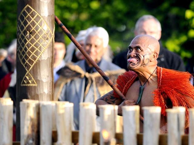 A Maori in traditional clothing performs during the inauguration of the garden 'Te Putake' dedicated to Maori culture in Les Jardins Fruitiers (fruit gardens) in Laquenexy, eastern France. The garden is the first outside of New Zealand to be dedicated to the Maori culture. AFP