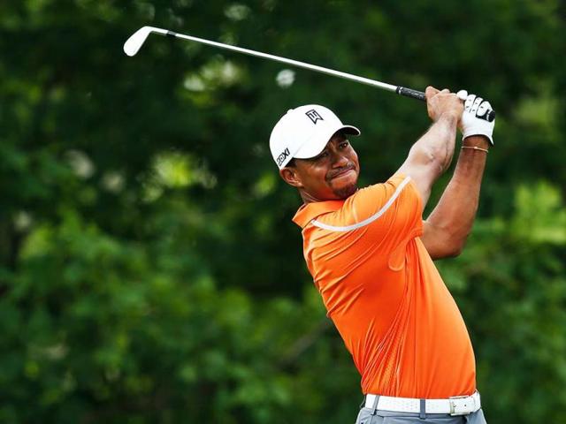 Tiger Woods watches his tee shot on the 14th hole during the first round of the Memorial Tournament presented by Nationwide Insurance at Muirfield Village Golf Club in Dublin, Ohio. (AFP)