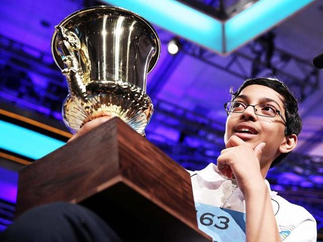 Arvind Mahankali of Bayside Hills, New York holds his trophy after the finals of the 2013 Scripps National Spelling Bee at Gaylord National Resort and Convention Center in National Harbor, Maryland. (AFP)