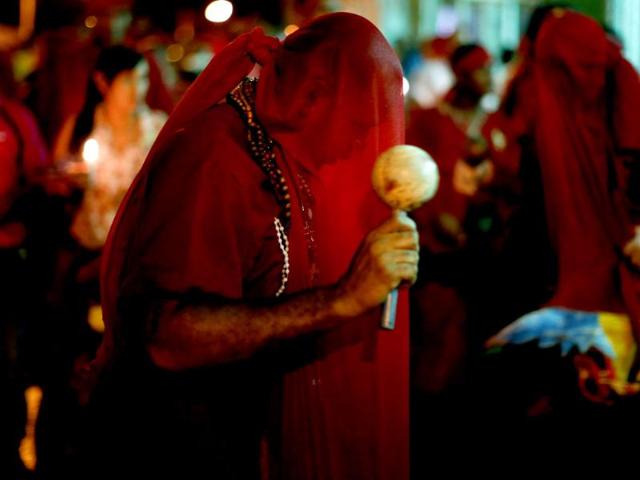 A participant of the "Diablos Danzantes" (Dancing Devils) of Yare performs to mark the Feast of Corpus Christi in San Francisco de Yare. The dancers perform the ritual dance celebrating the transformation of the body and blood of Christ into bread and wine. (Reuters)