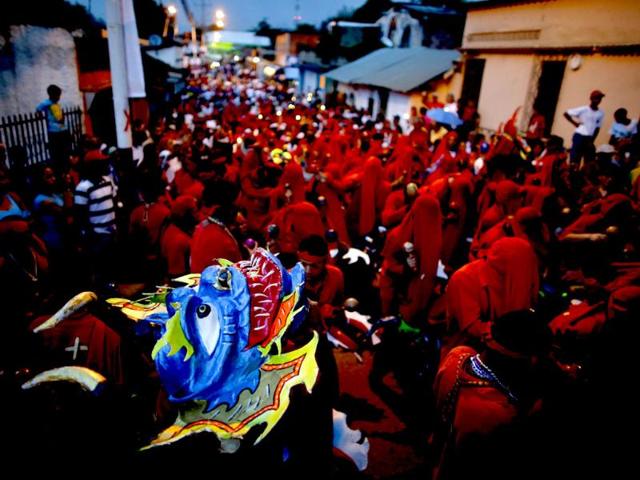 Participants of the "Diablos Danzantes" (Dancing Devils) of Yare performs to mark the Feast of Corpus Christi in San Francisco de Yare. The dancers perform the ritual dance celebrating the transformation of the body and blood of Christ into bread and wine. (Reuters)