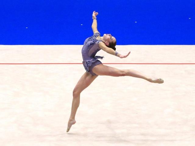 Katsiaryna Halkina from Belarus performs with the ball during the senior individual team competition as part of the 29th rythmic gymnastics European Championships held at the Stadthalle in Vienna. (AFP)