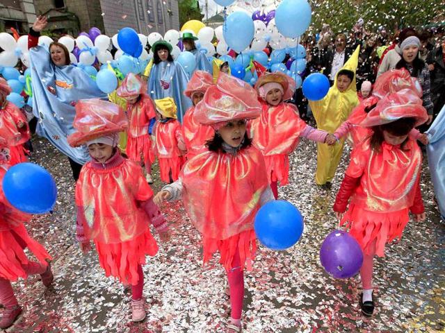 Children take part in the Children's Carnival in the centre of Russia's Siberian city of Krasnoyarsk. Thousands of children, their relatives and teachers took part in the procession to celebrate International Children's Day. (Reuters)