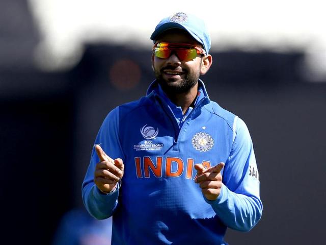 India's Virat Kohli reacts to cheering from supporters during the ICC Champions Trophy warm-up cricket match between India and Sri Lanka, at Edgbaston cricket ground in Birmingham. AP/Sang Tan