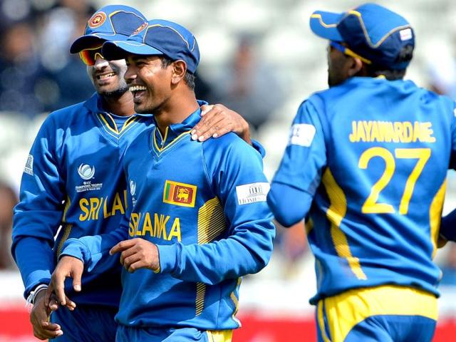 Sri Lanka's Nuwan Kulasekara (2nd L) celebrates after catching India's Rohit Sharma during the warm-up cricket match ahead of the 2013 ICC Champions Trophy at Edgbaston in Birmingham. AFP/Andrew Yates