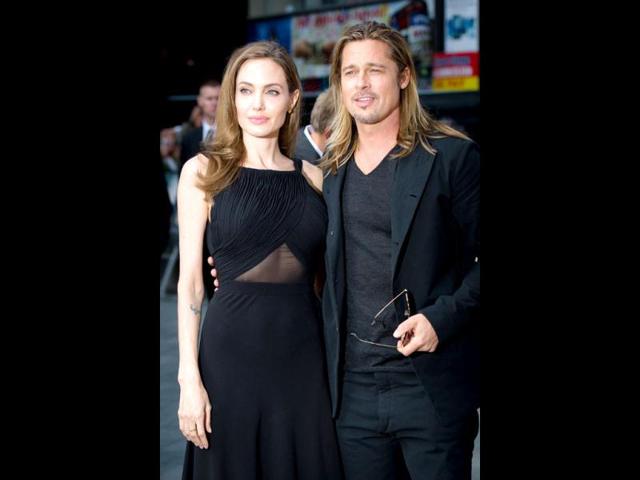 Brave heart! A confident Angelina Jolie poses with Brad Pitt. (AFP Photo) 