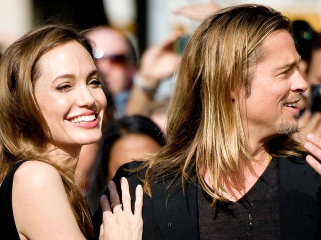 Jolie looked resplendent in her first outing after the double mastectomy. Occasion was cheering Brad Pitt during World War Z's UK premiere. (AFP Photo) 
