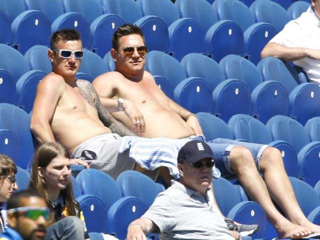 Fans enjoy the sunny weather during a warm up cricket match for the upcoming ICC Champions Trophy between India and Australia at the Cardiff Wales Stadium in Cardiff, Wales. (AP Photo)
