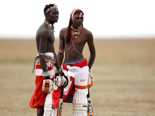 Sonyanga Olengais (L), captain of the Maasai Cricket Warriors talks to his teammate Mamai Simon Papai during their T20 cricket match against the Ambassadors of Cricket from India in Ol Pejeta conservency in Laikipia national park. REUTERS