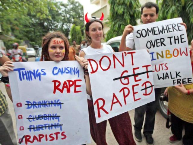 Participants holds posters during "Slut Walk" to protest against any form of sexual harassment of any gender in public places, in Kolkata. (PTI)