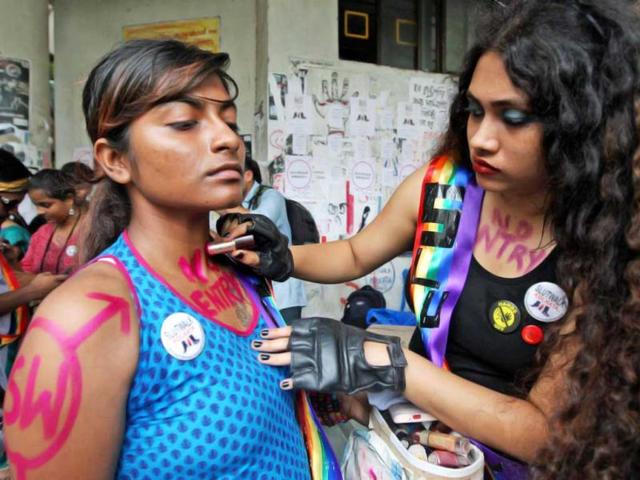Participants paint their body during "Slut Walk" to protest against any form of sexual harassment of any gender in public places, in Kolkata. (PTI)