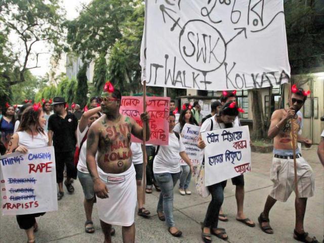 Participants holds posters during "Slut Walk" to protest against any form of sexual harassment of any gender in public places, in Kolkata. (PTI)