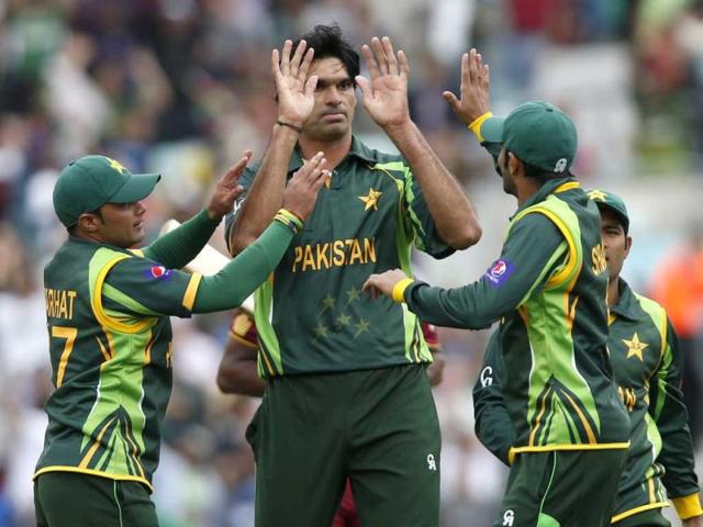 Muhammad Irfan, center, celebrates with teammates the wicket of West Indies' Johnson Charles caught by teammate Wahab Riaz during their ICC Champions Trophy group B cricket match at the Oval cricket ground in London. (AP)
