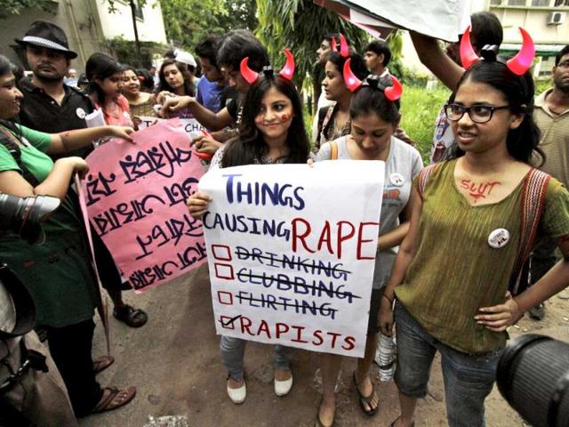 Activists of the LGBT rights movement stand with posters during a "Slut Walk" in Kolkata. (AP)