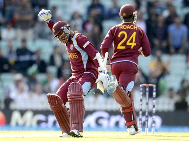 Denesh Ramdin (L) and Kemar Roach celebrate as their team sealed a two wicket win over Pakistan in the ICC Champions Trophy group B match at The Oval cricket ground in London. (Reuters)