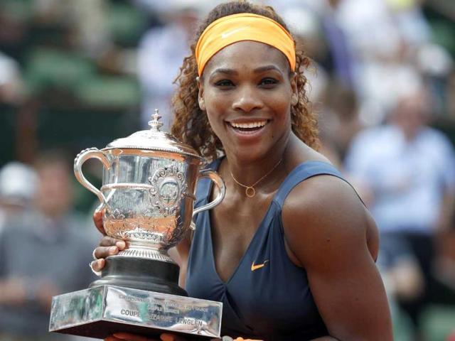 USA's Serena Williams poses with the Suzanne-Lenglen trophy after winning the 2013 French tennis Open final against Russia's Maria Sharapova at the Roland Garros stadium in Paris. (AFP)
