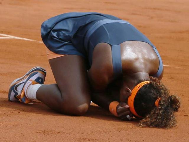 USA's Serena Williams celebrates as she wins the 2013 French tennis Open final against Russia's Maria Sharapova at the Roland Garros stadium in Paris. (AFP)