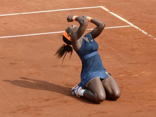 USA's Serena Williams celebrates as she wins the 2013 French tennis Open final against Russia's Maria Sharapova at the Roland Garros stadium in Paris. (AFP)